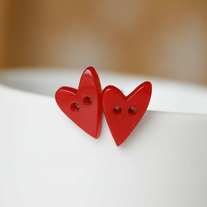you break my heart. heart shape button earrings.