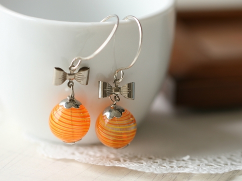 elegant orange hollow glass earrings.