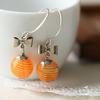 elegant orange hollow glass earrings.