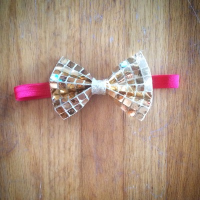 Gold square sequin bow on red elastic