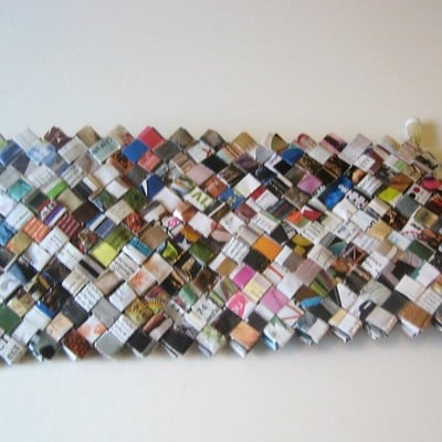 Eco-friendly clutch made with colorful magazines, catalogs and junk mail lined with cotton