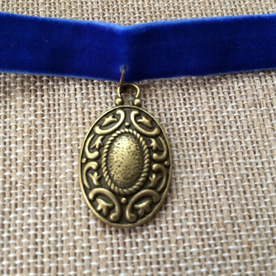 Moon and stars medallion choker in royal / brass