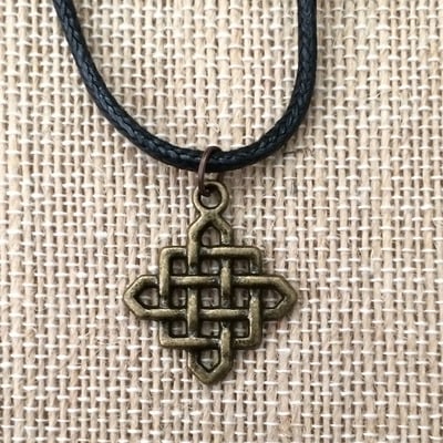 Infinity necklace in black / brass