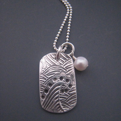 Mavericks tag m, on chain with pearl