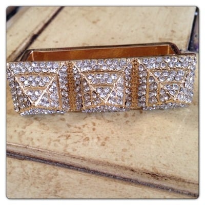 Gold tone triple finger rhinestone pyramid ring