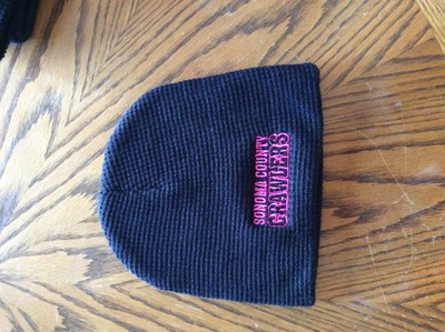 Black skull cap beanie pink writing 
