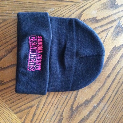 Regular black beanie pink writing 
