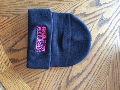 Regular black beanie pink writing 