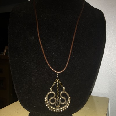 Dangling piece on long leather chain