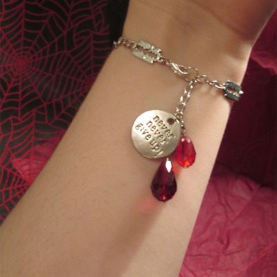 “never give up” self-harm razor blade and blood drops bracelet