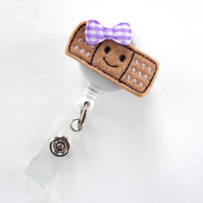 Smiling bandaid - retractable badge reel - name badge holder - nurse badge holder - pediatric nurse badge - felt badge - rn badge holder