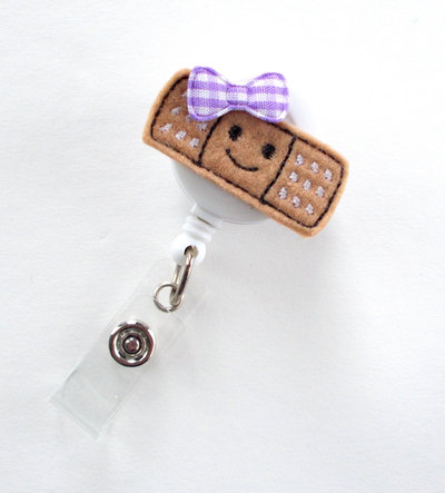 Smiling bandaid - retractable badge reel - name badge holder - nurse badge holder - pediatric nurse badge - felt badge - rn badge holder
