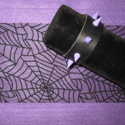 Black leather bracelet with lavender spikes