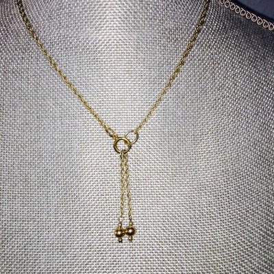 Gold rope chain with dangling pendant