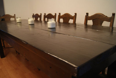 Hand made custom table .  ebony stain with clear coat.  benches available.  big solid table.  great work station as well