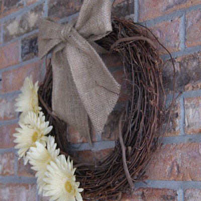 Wood wreath, yellow floral.  sewn burlap bow.  handmade