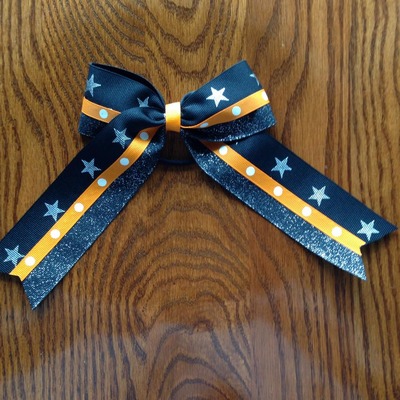 Glitter black with silver stars and orange dots