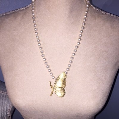 Pearls with butterfly pendant