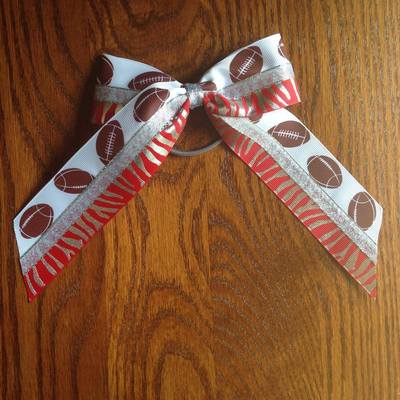 Footballs with red and silver zebra