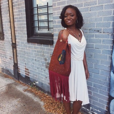 Shy peacock ankara bucket bag with fringe