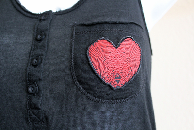 Passport 2 freedom womens black fingerheartprint pocket top (back in stock)