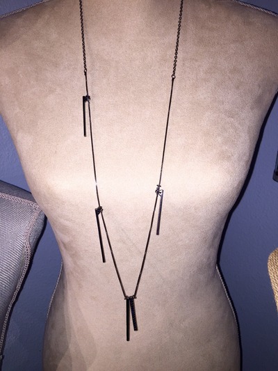 Long black chain with multiple dangling pendants