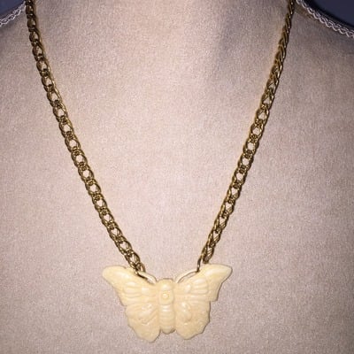 Butterfly pendant on gold chain
