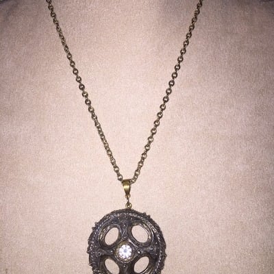 Bold circle pendant with sparkle in center
