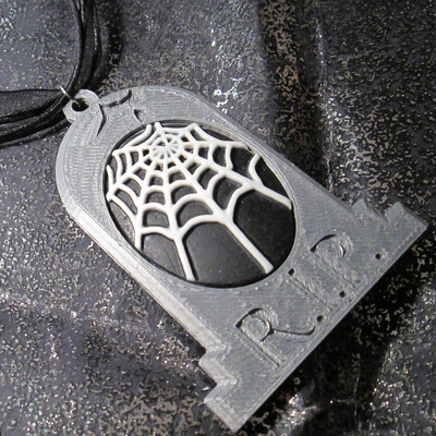 Grey tombstone necklace with white and black spider web cameo 