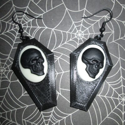 Small black coffin earrings with black and white skull cameos 