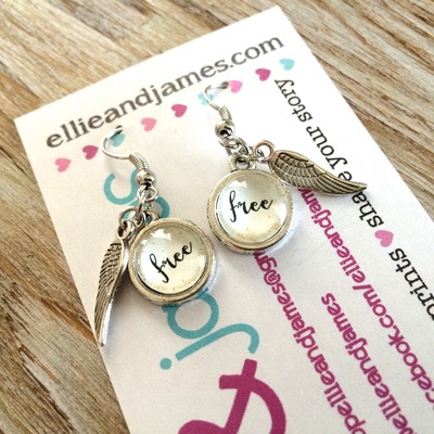 Pendant earrings with charm