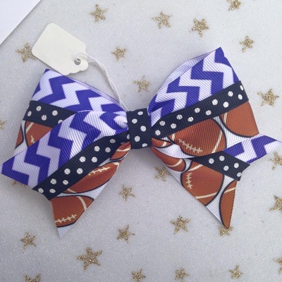 Footballs with purple chevron and black dots