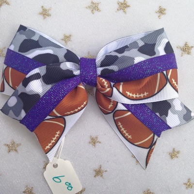 Footballs with black/grey camo and glitter purple