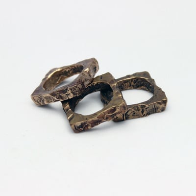 Cast bronze circle in square rings