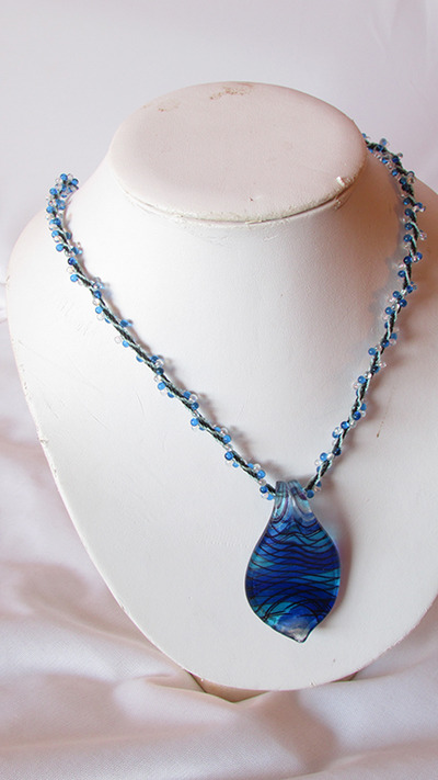 Lampwork pendant on kumihimo necklace
