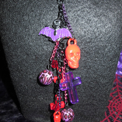 Ultra long red & purple leopard, skull, cross and bat necklace and earrings set