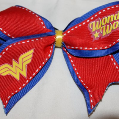 "wonder woman" - 2 in blue grosgrain ribbon layered with red ribbon with a yellow center  cheer bow