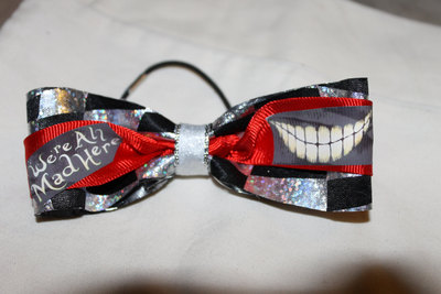 "WE'RE ALL MAD HERE" Cheshire Cat Grin- 2 in Black & Silver Ribbon with a Red Center  Cheer Bow