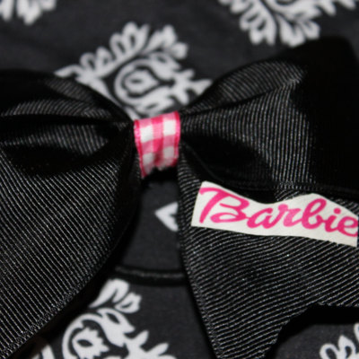 "barbie" - 2 in black grosgrain ribbon with a pink gingham center 