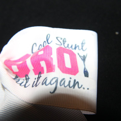 "cool stunt bro...."2 in white grosgrain ribbon with hot pink center 