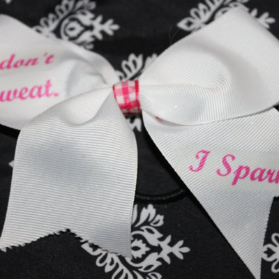 "i don't sweat, i sparkle" bling cheer bow; - 2 in white grosgrain ribbon with pink ginham center  