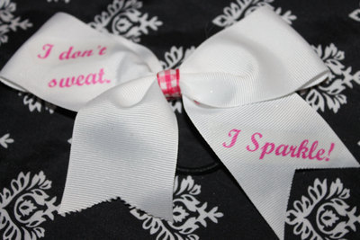 "I DON'T SWEAT, I SPARKLE" BLING CHEER BOW; - 2 in White Grosgrain Ribbon with Pink Ginham center  