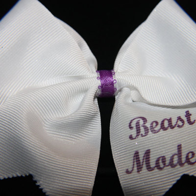 "beast mode"   2 in white grosgrain ribbon with purple center 