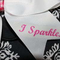 "I DON'T SWEAT, I SPARKLE" BLING CHEER BOW; - 2 in White Grosgrain Ribbon with Pink Ginham center   - Thumbnail 1