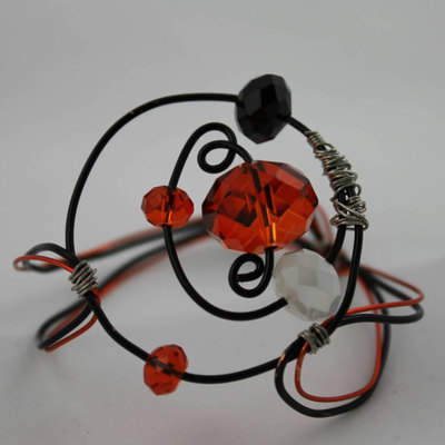 Circle the orbit wire bracelet with black, orange & white swarovski crystals