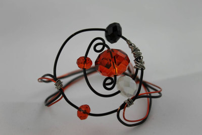 Circle the Orbit Wire Bracelet with Black, Orange & White Swarovski Crystals