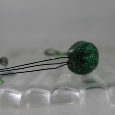 "poppy" in enchanted resin and black wire  