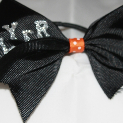 Stunt group - "flyer" 2 in black grosgrain ribbon with an orange & white polka dots center; base in silver bling letters cheer bow
