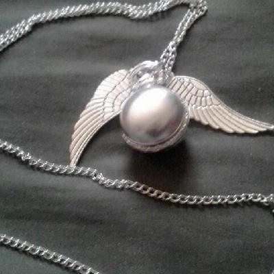 Silver sphere locket with angel wings