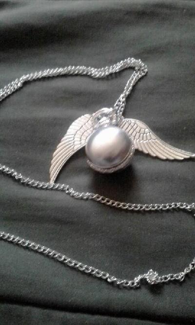 Silver sphere locket with angel wings